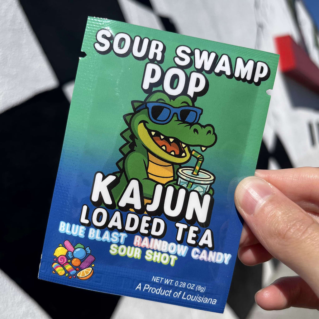 Sour Swamp Pop Kajun Loaded Tea packet held by a person